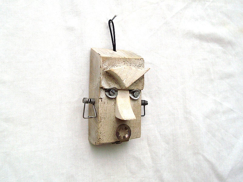 Primitive mask inspired Face -found objects assemblage
