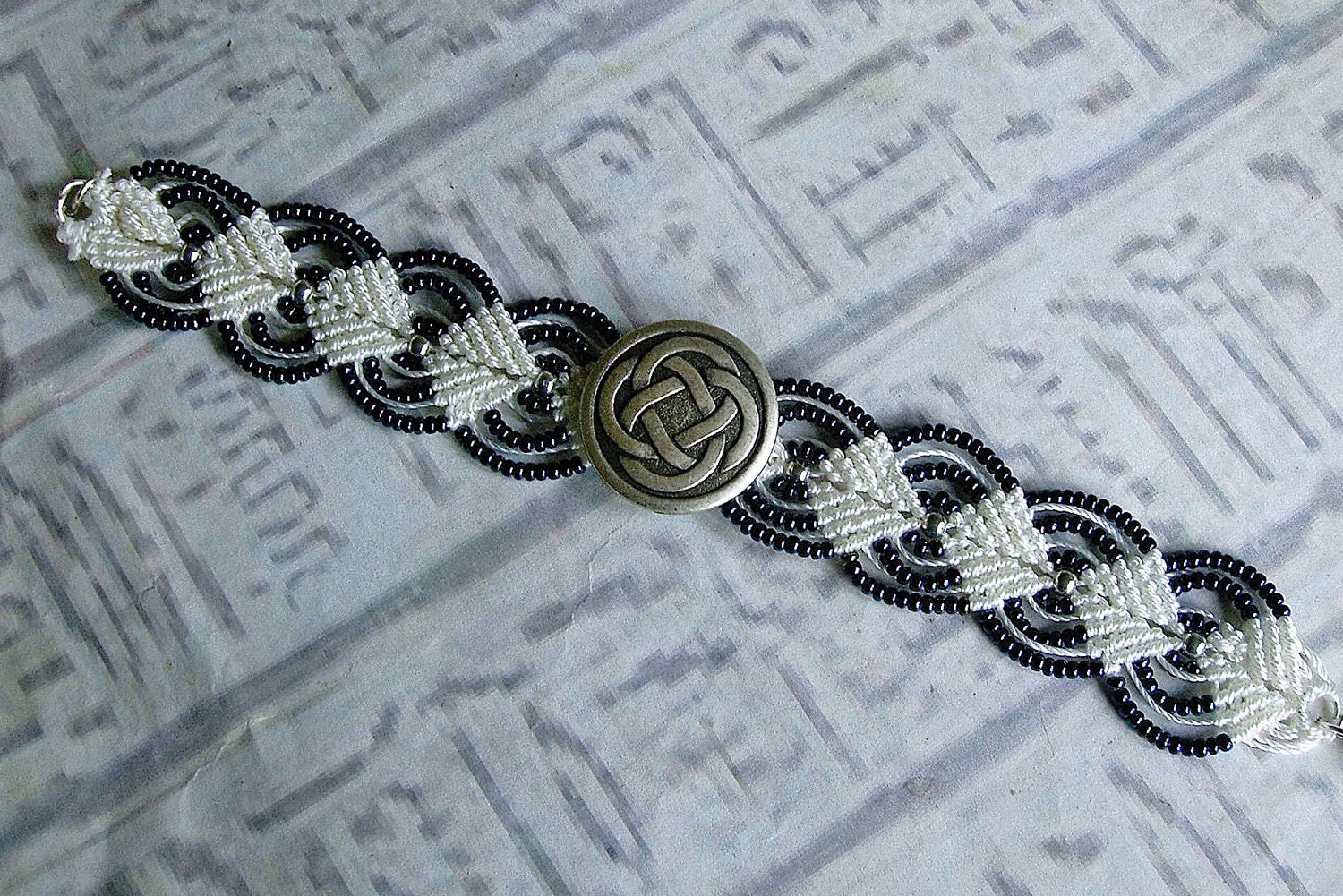 Celtic knot beaded micro macrame bracelet in midnight blue and white.