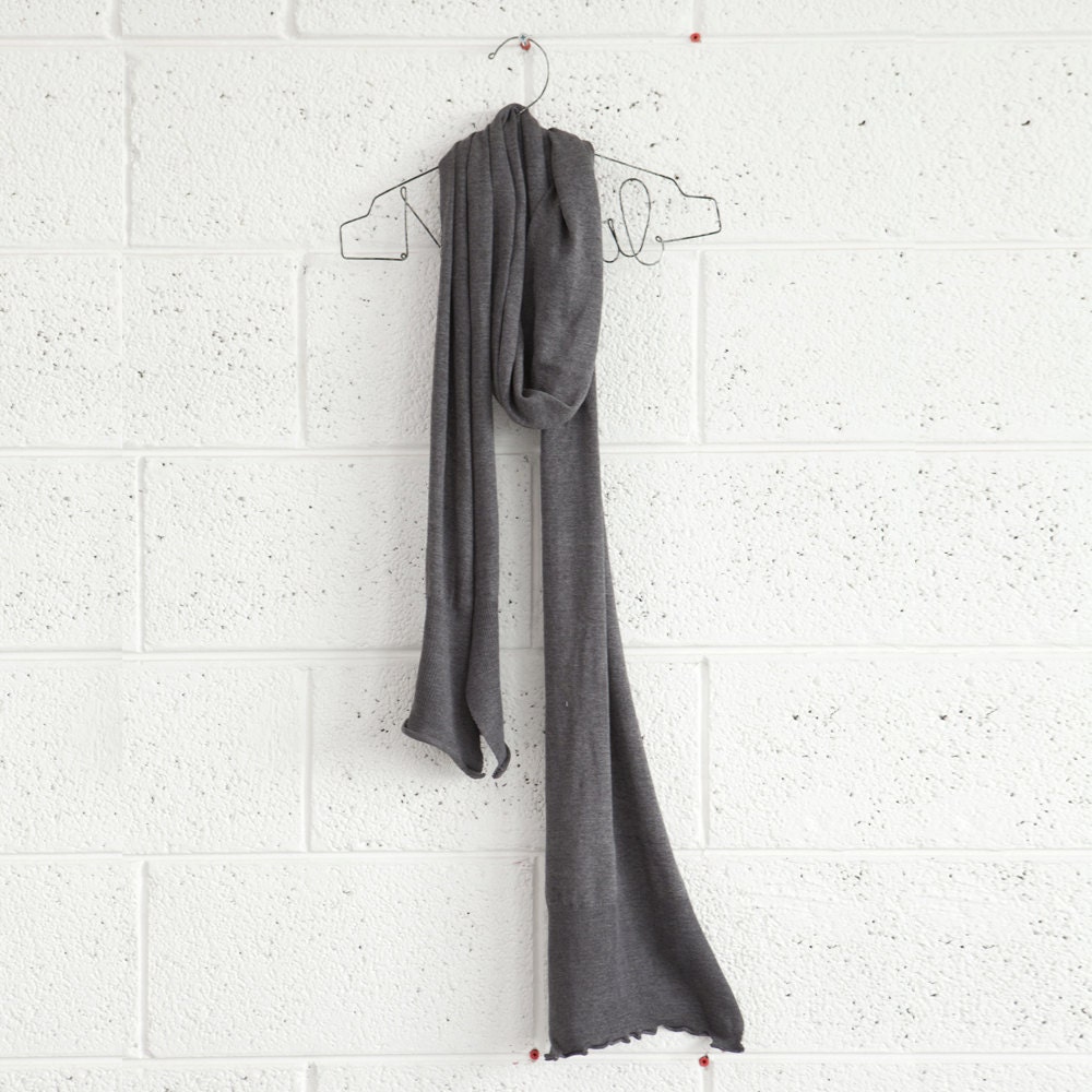 Women knitted, grey scarf,winter fashion.
