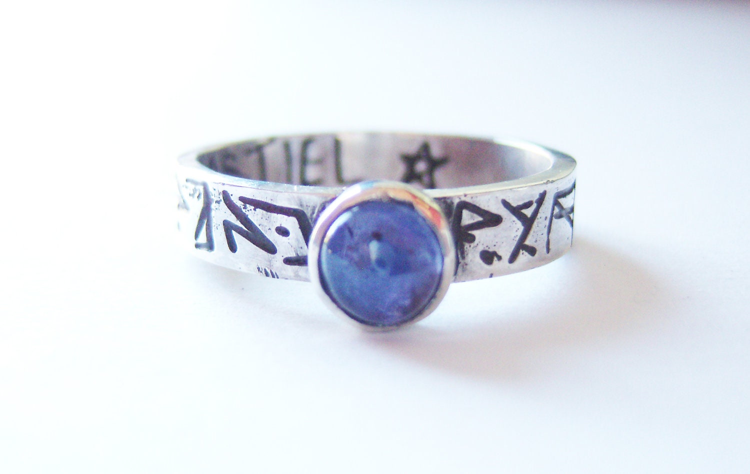 Supernatural silver and iolite etched ring with the inscription CASTIEL inside