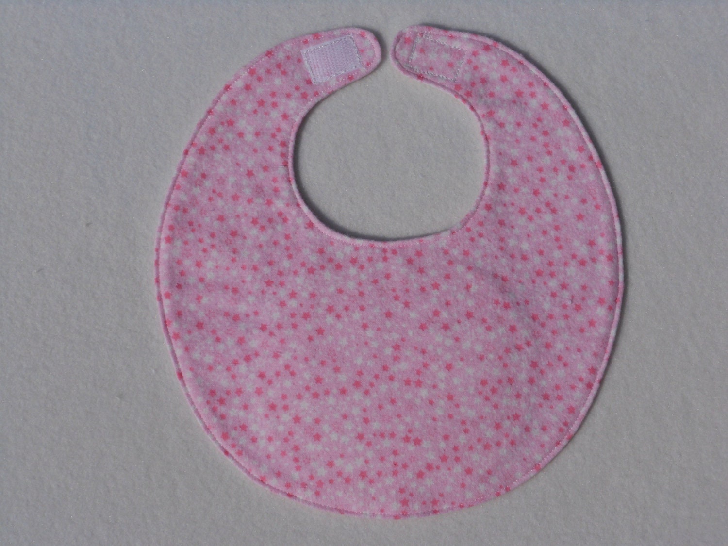 Baby Bibs, four soft layers, reversible, pink with tiny pink and white stars, and white with pink dots on the flip sideide
