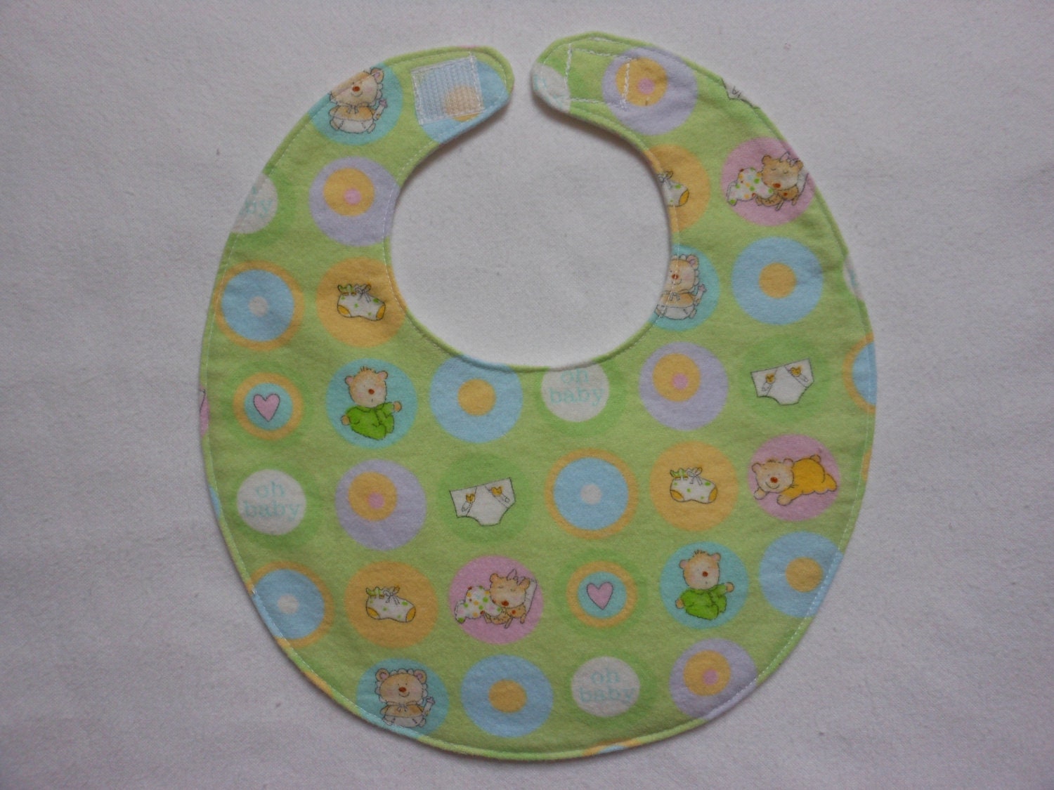 Baby bib, four soft layers, reversible, green with baby bears.