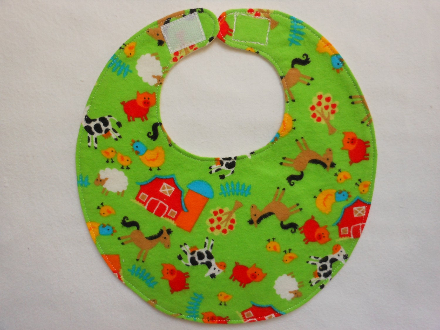 Baby Bibs, four soft layers, reversible, green with red barns and farm animals