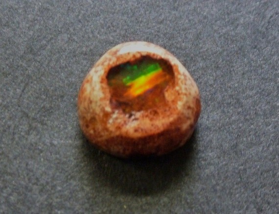Fire Opal or Mexican Cantara Opal, a dainty delight wrapped in its pretty apricot colored matrix