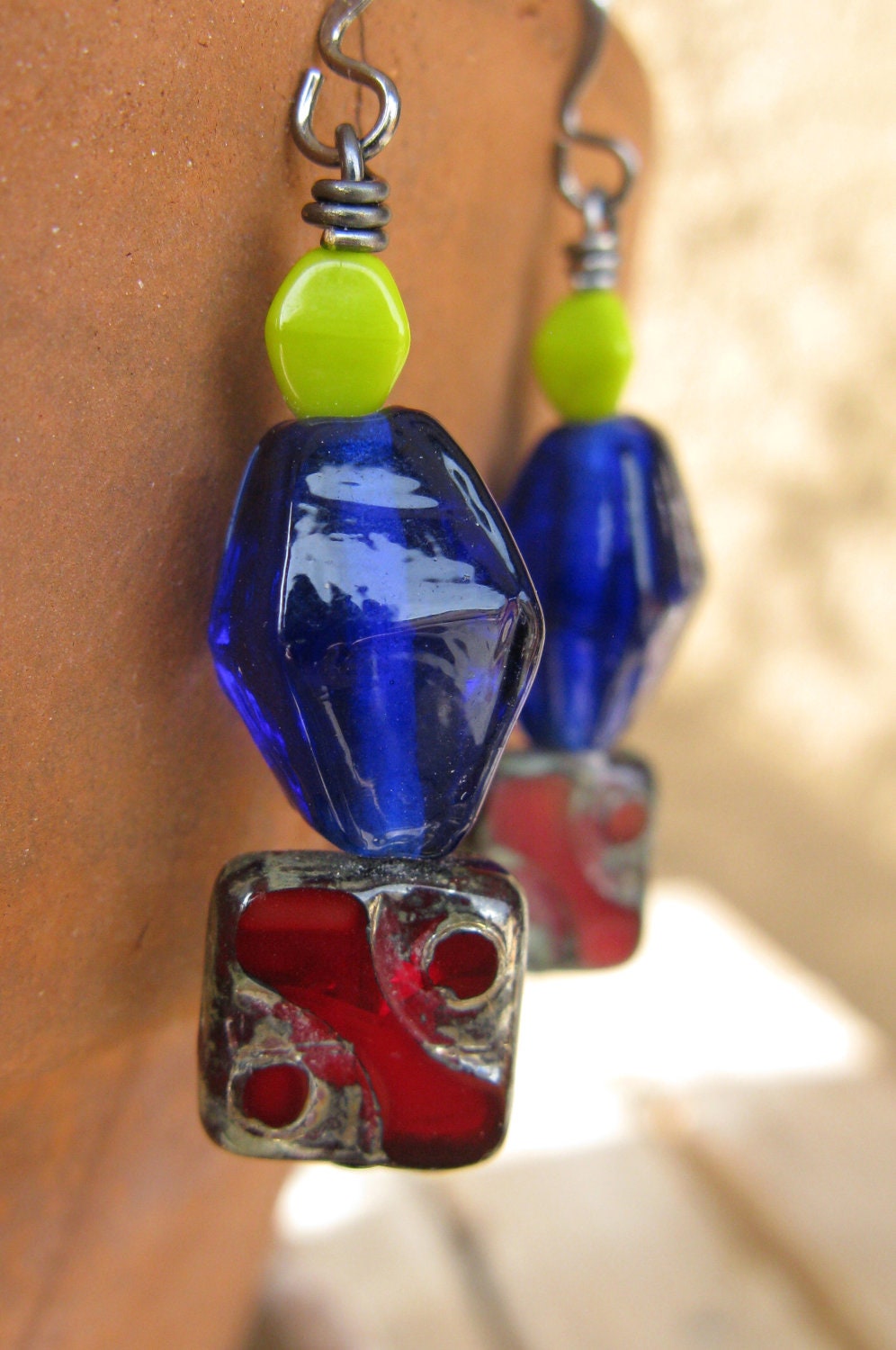 Bright red and blue earrings with yellow