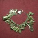 Vintage Sterling Charm Bracelet with 18 Sterling Charms