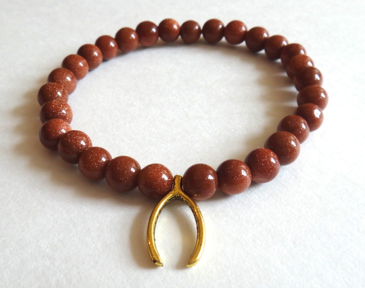 Brown Goldstone Beaded Bracelet with Gold Wishbone
