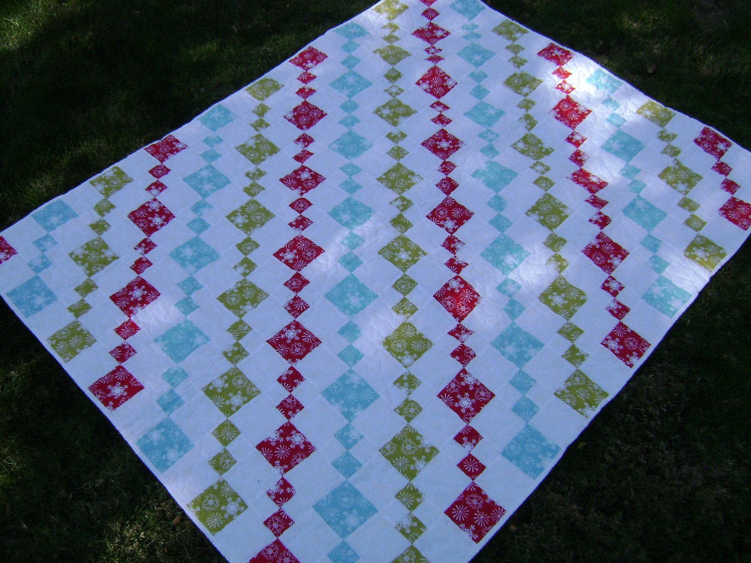 Modern Winter Wonderland Lap Quilt in white, red, turquoise, and acid yellow - Handmade Holiday Patchwork Blanket