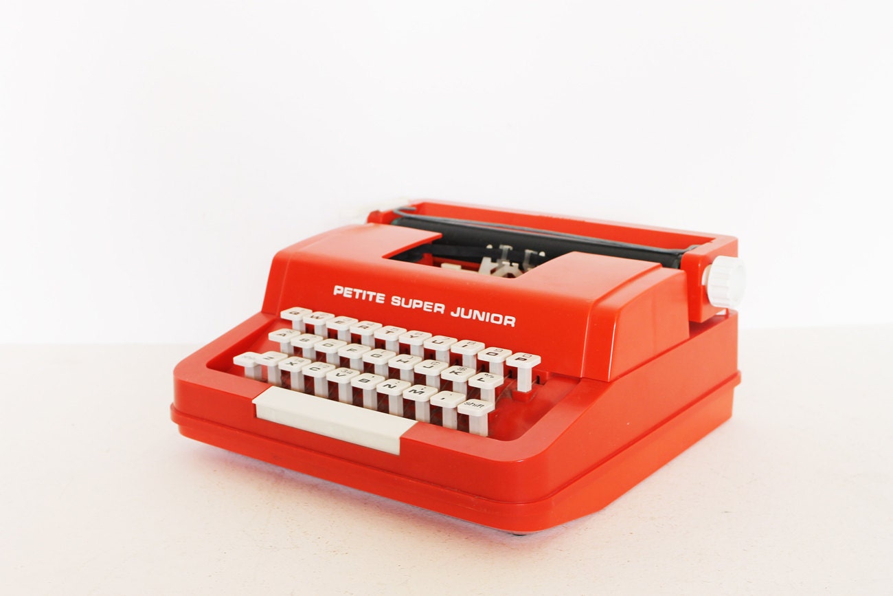 Vintage red typewriter by Byron Jardine Limited