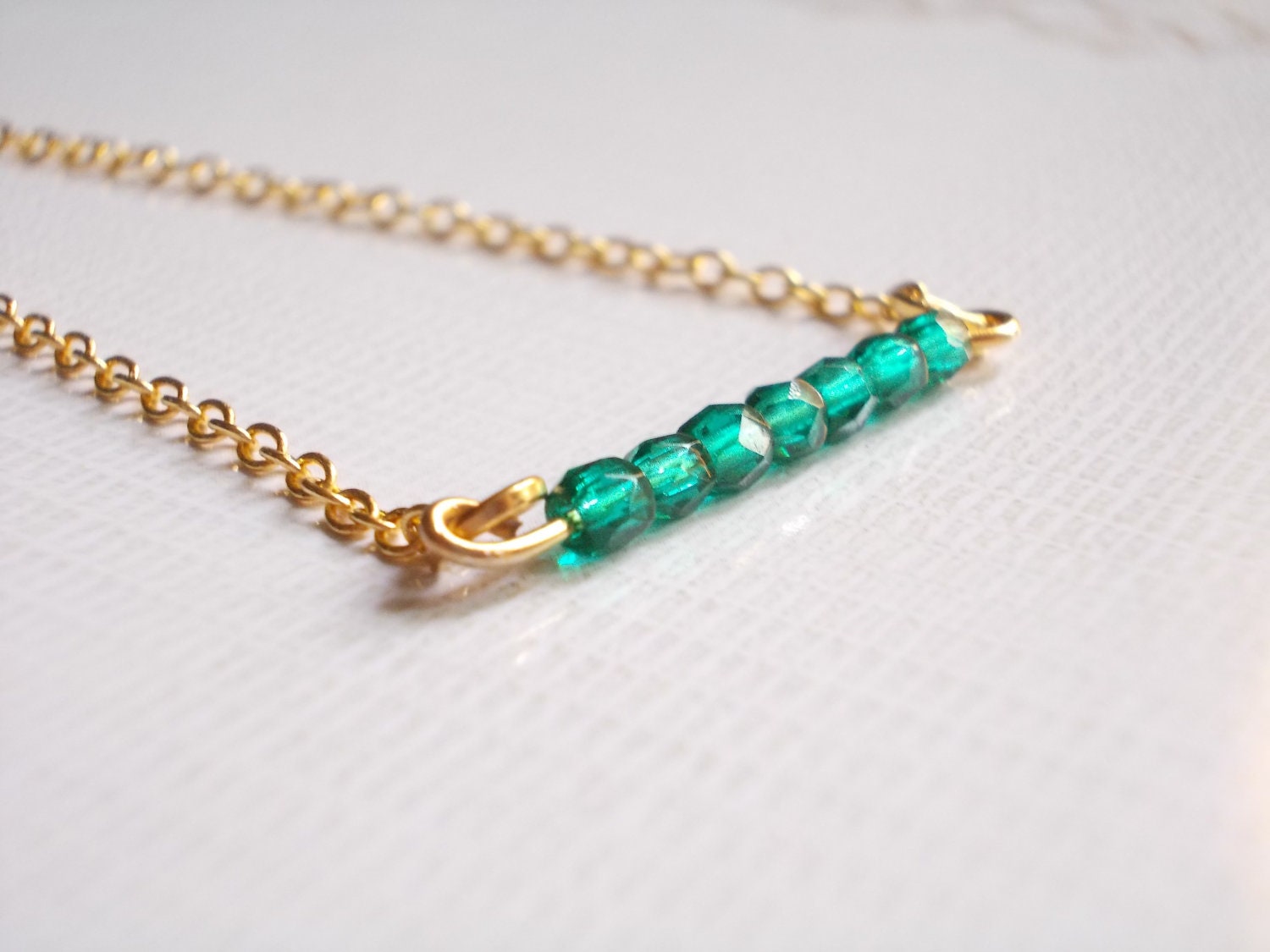 Emerald green bracelet. Tiny gold metal chain. Beaded bracelet.