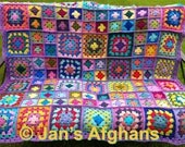 Crocheted afghan kaleidoscope granny squares with lavender border
