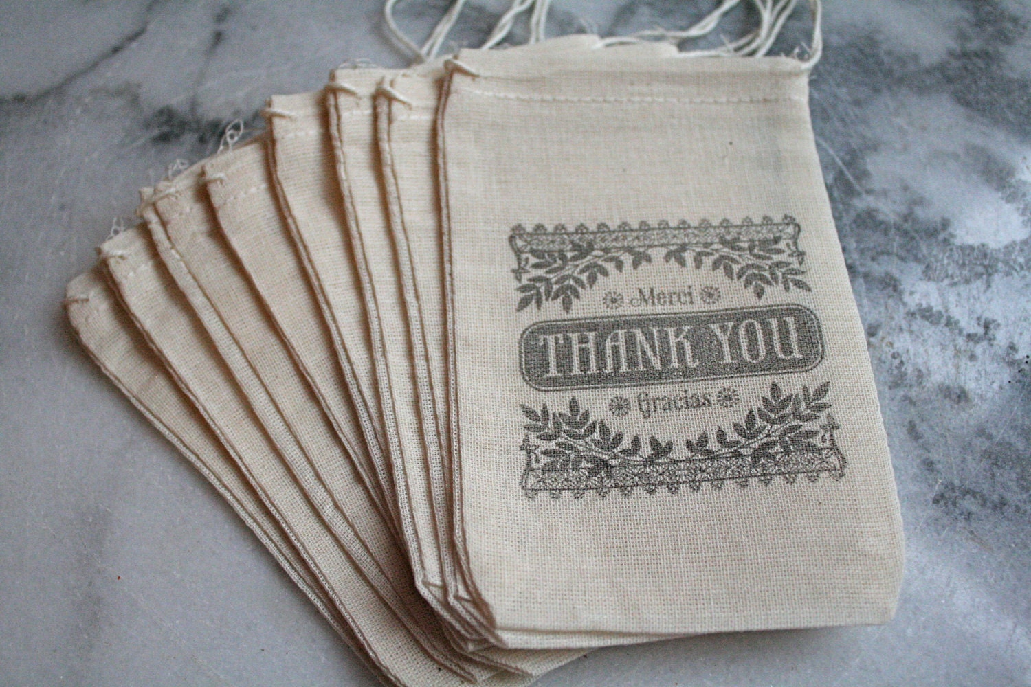 Wedding favor bags, muslin, 3x5. Set of 50. Old fashioned Thank You Merci Gracias script in black on natural muslin.