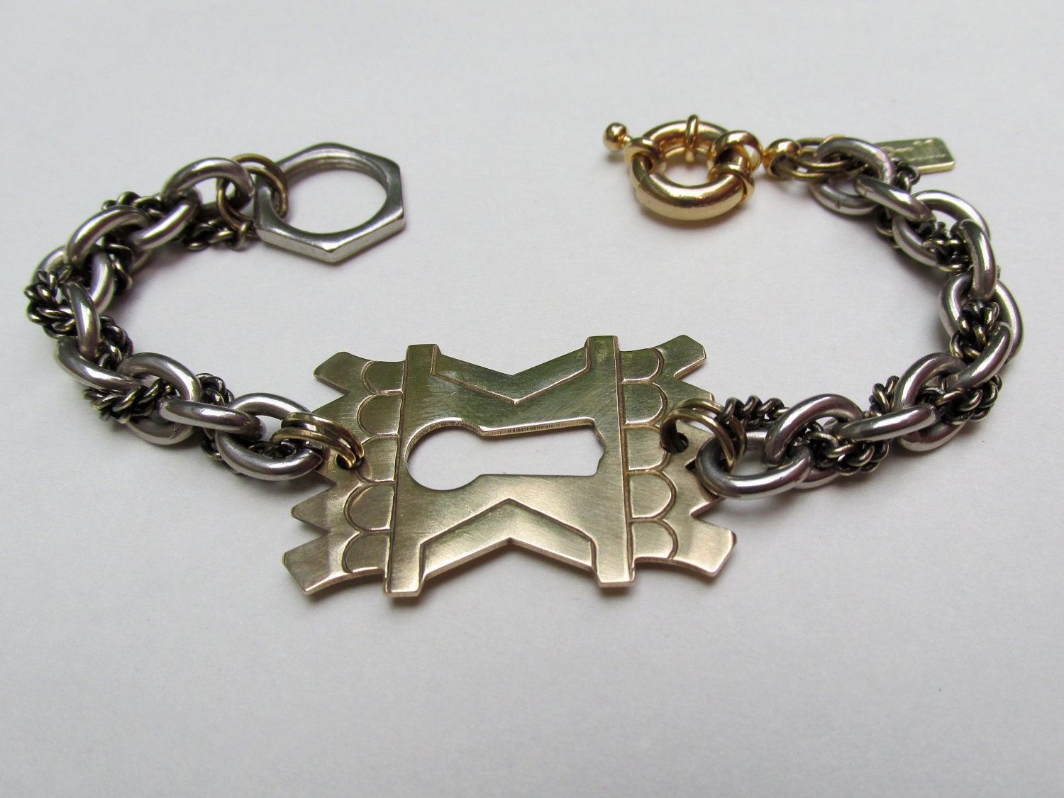 Astor Bracelet: heavy  cuff with pierced keyhole