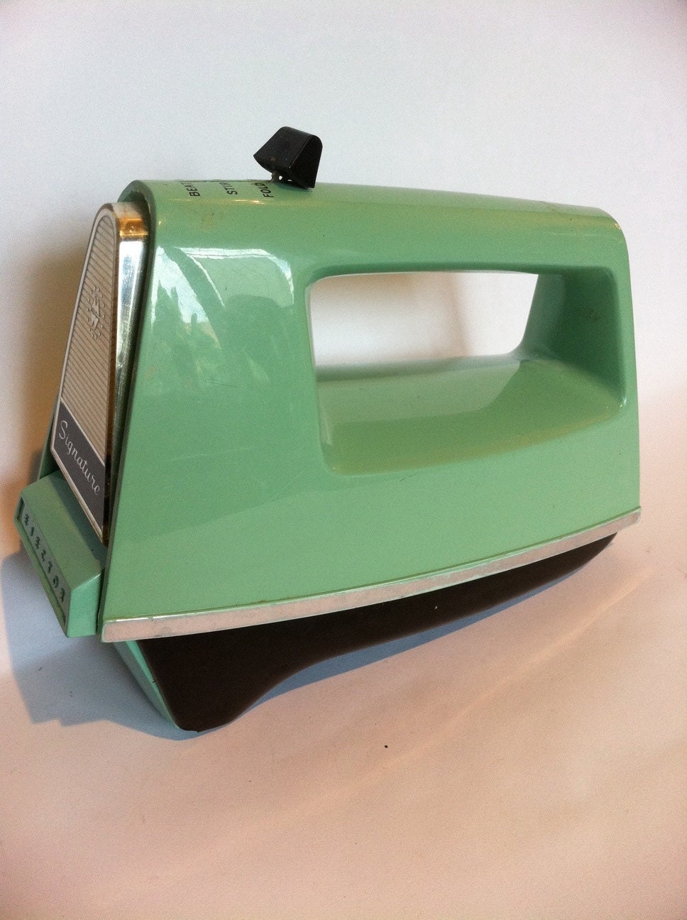 Vintage Signature green hand mixer.