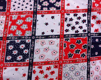 Vintage red white and blue floral tablecloth.  Crochet trim.  Rounded corners.