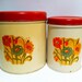 Vintage red floral canisters. Set of 2. Tin metal
