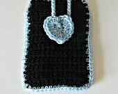 Crocheted phone cover in black with a pale blue heart and trim