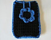 Crocheted phone cover in black with a mid blue flower and trim