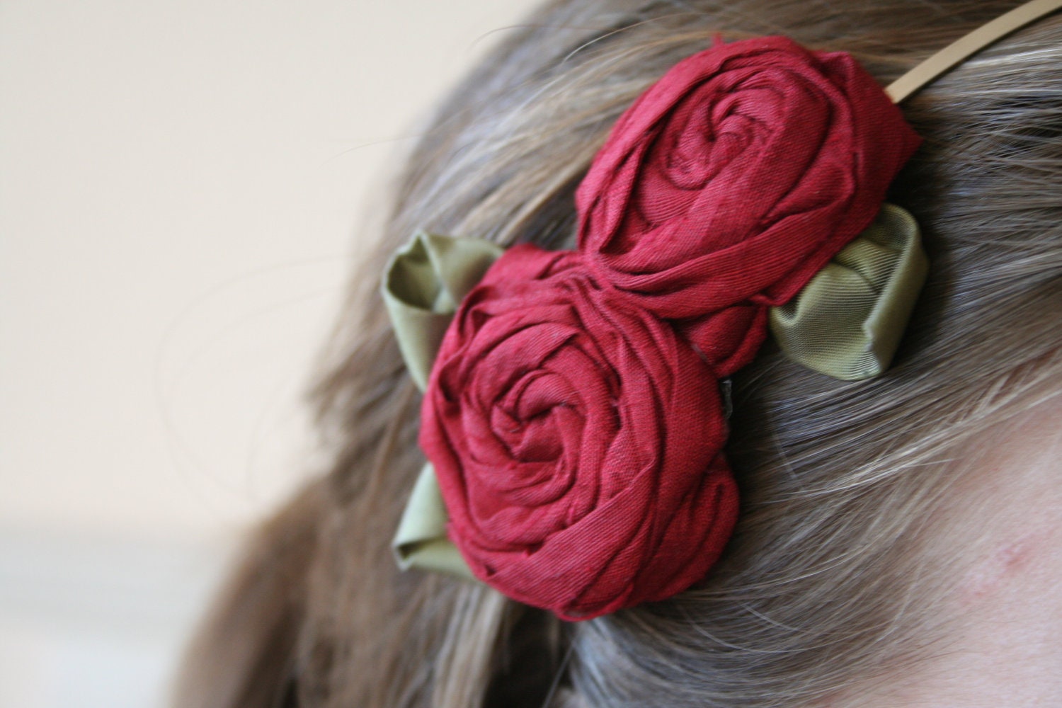 Fabric flower headband // Red hand made silk roses with green silk leaves on a silver metal headband.
