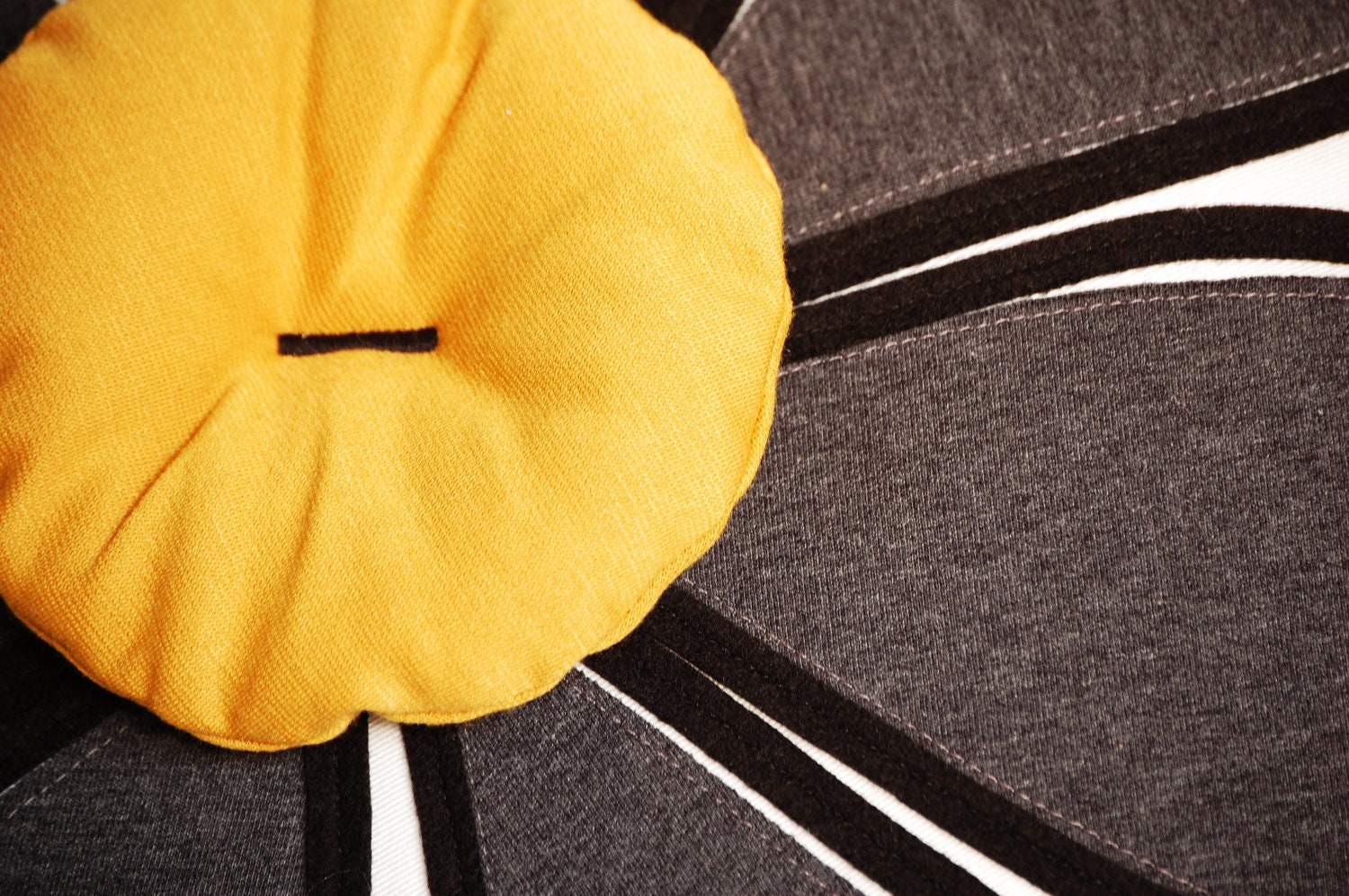 My favorite, grey and yellow flower cushion cover, 18" square, black felt detailing, mod/retro flair.