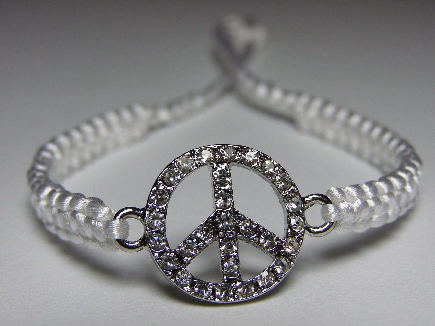 Peace sign bracelet with rhinestones