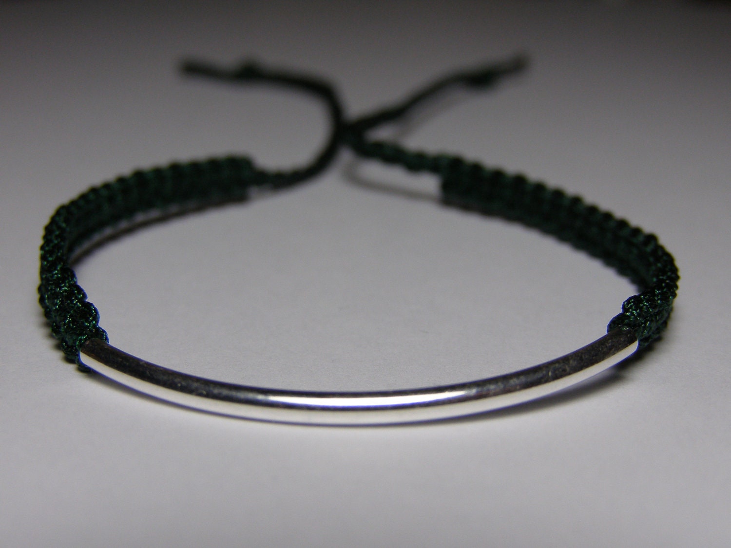 Silver bar bracelet with dark green macrame cord