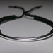 Silver bar bracelet with dark green macrame cord
