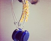 wire wrapped with carnelian with deep blue ceramic bead