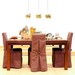 Triple light chandelier. Orange and natural flowers and leaves.