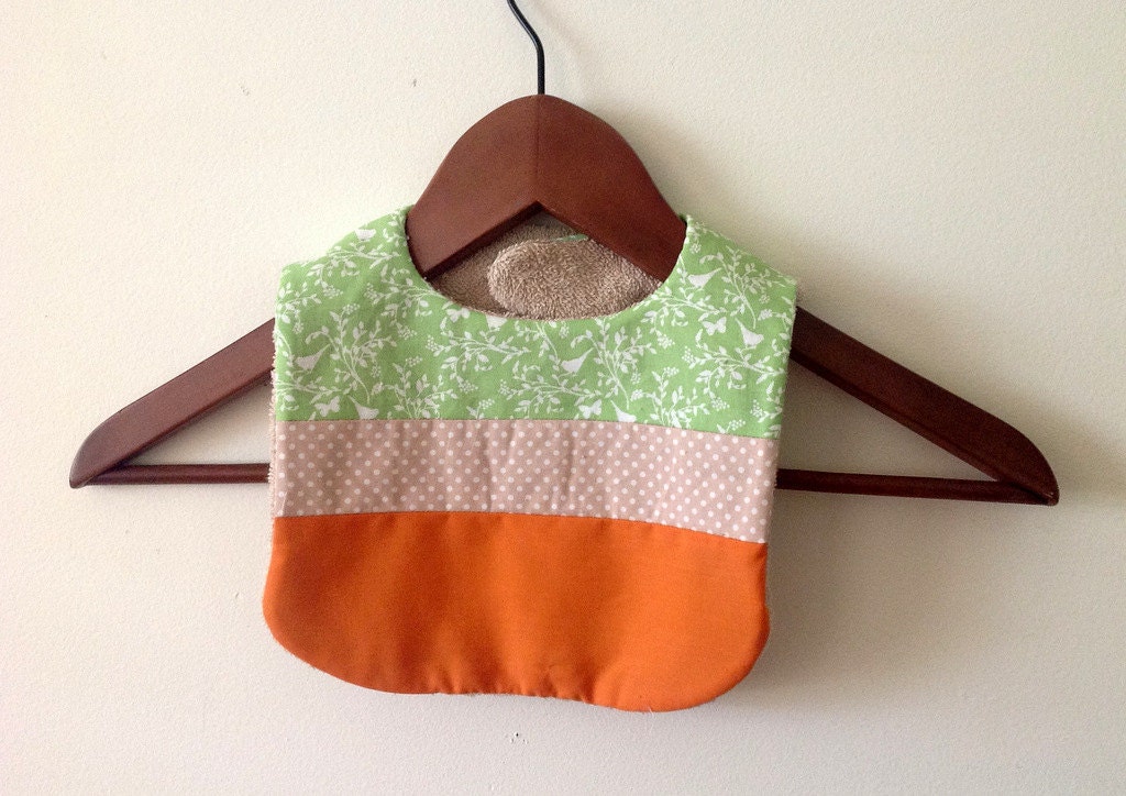 Handmade Baby Bib in woodland green, taupe polka dots and burnt orange.