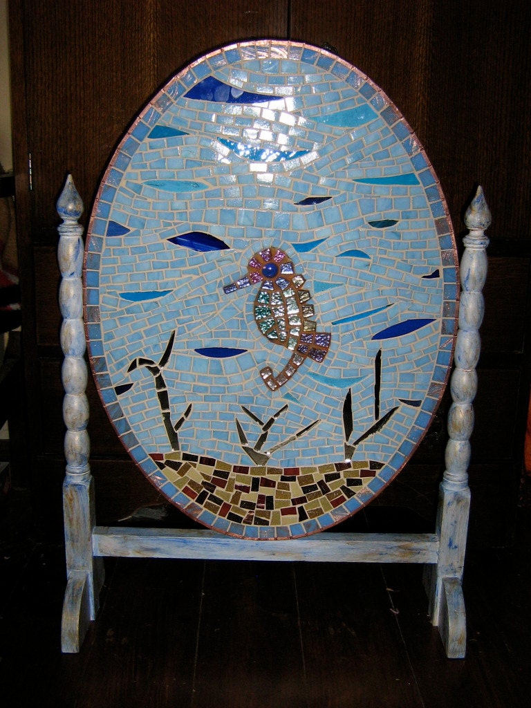 Mosaic Seahorse Fireguard: 1940s wooden oval guard set in turned supports.