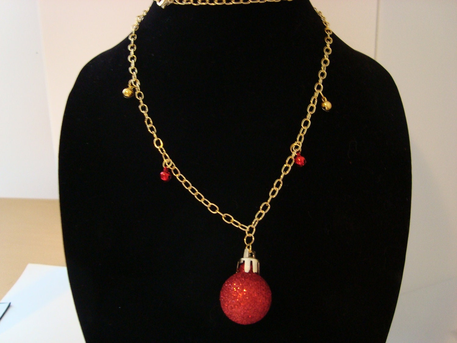 Holiday ornament necklace with jingle bells