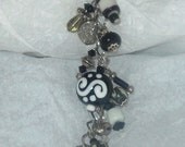 Black and  white beaded bracelet with beautiful handcrafted lampwork beads antiqued silver beads