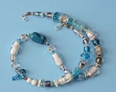 Blue and white beaded necklace, with a mix of handmade art glass, ceramic, turquoise, Czech glass beads  and more. 17 3/4 Inches long