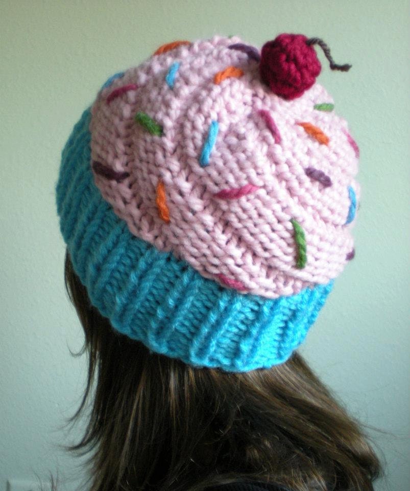 Light pink cupcake hat in a blue wrapper