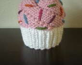 Light pink cupcake hat in white wrapper