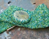 DragonSkin, handmade beadwork cuff with handmade raku cab