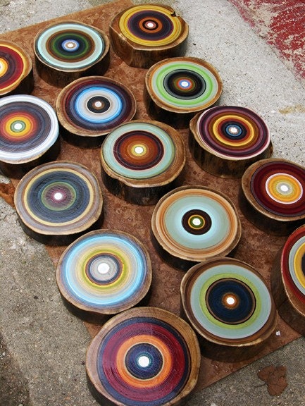 Freshen your walls this spring with a large set of tree ring paintings raw wood and pops of color