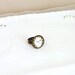 Time travel ring with old world paris clock button