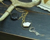 PINE & MOON LODGE. Antique Skeleton Key, Rough Moonstone Nugget and Carved Ebony Wood Coin Bead . Rustic Unisex necklace