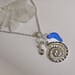 Sea glass necklace with ammonite charm. Beach glass seaglass jewelry.
