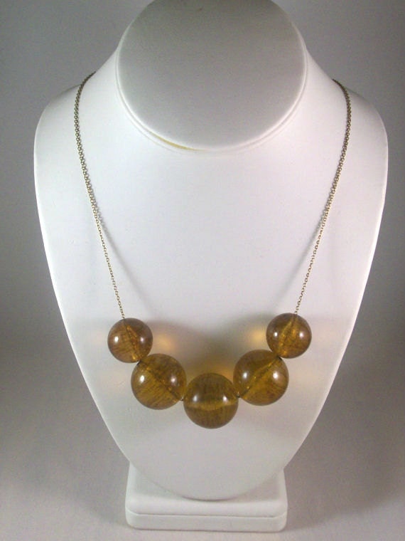 Amber Aura Necklace: amber colored beads on a brass chain