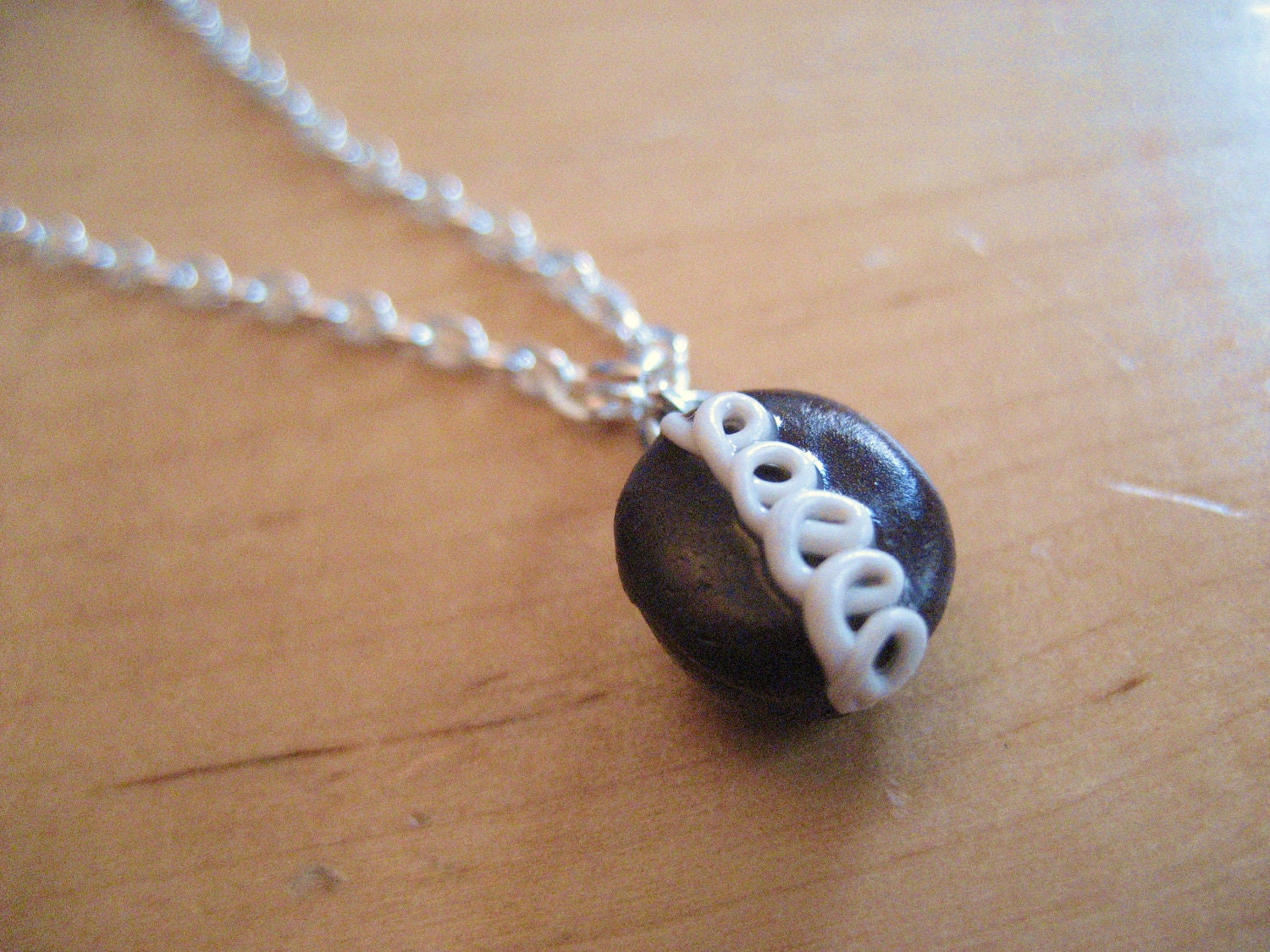 Hostess cupcake snack cake necklace made from polymer clay