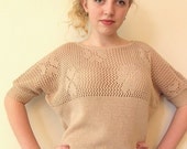 Desert batwing sweater with openwork hearts