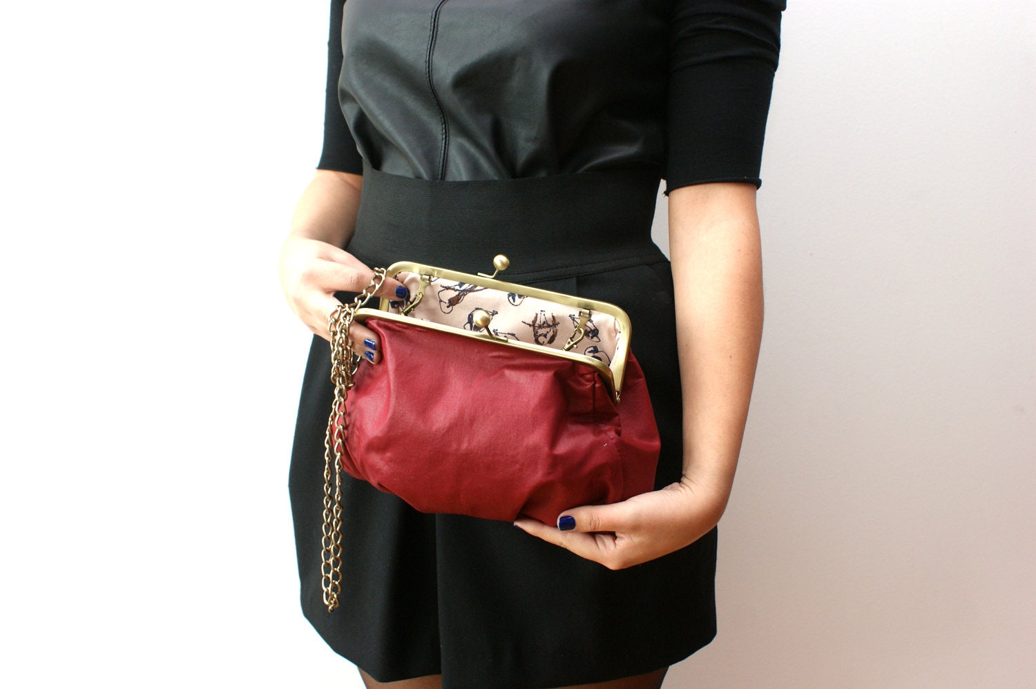Dark red fabric clutch