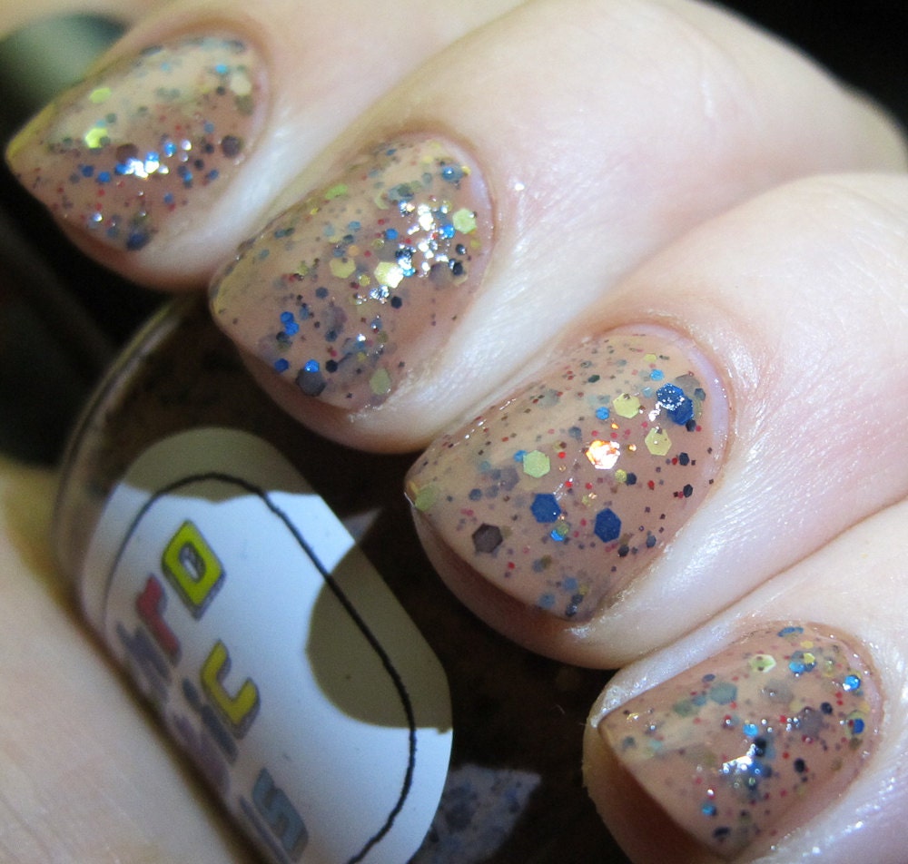Horse Lord Nail Polish - dusty brown with red, blue, and earthtone glitter