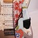 Asian inspired bright blue and red stars guitar strap