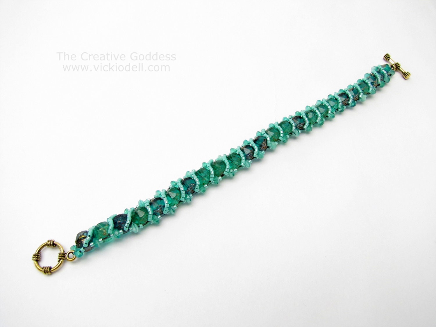 8 1/2 inch long Beadwoven Bracelet in Green Blue Turquoise and Vintage Gold
