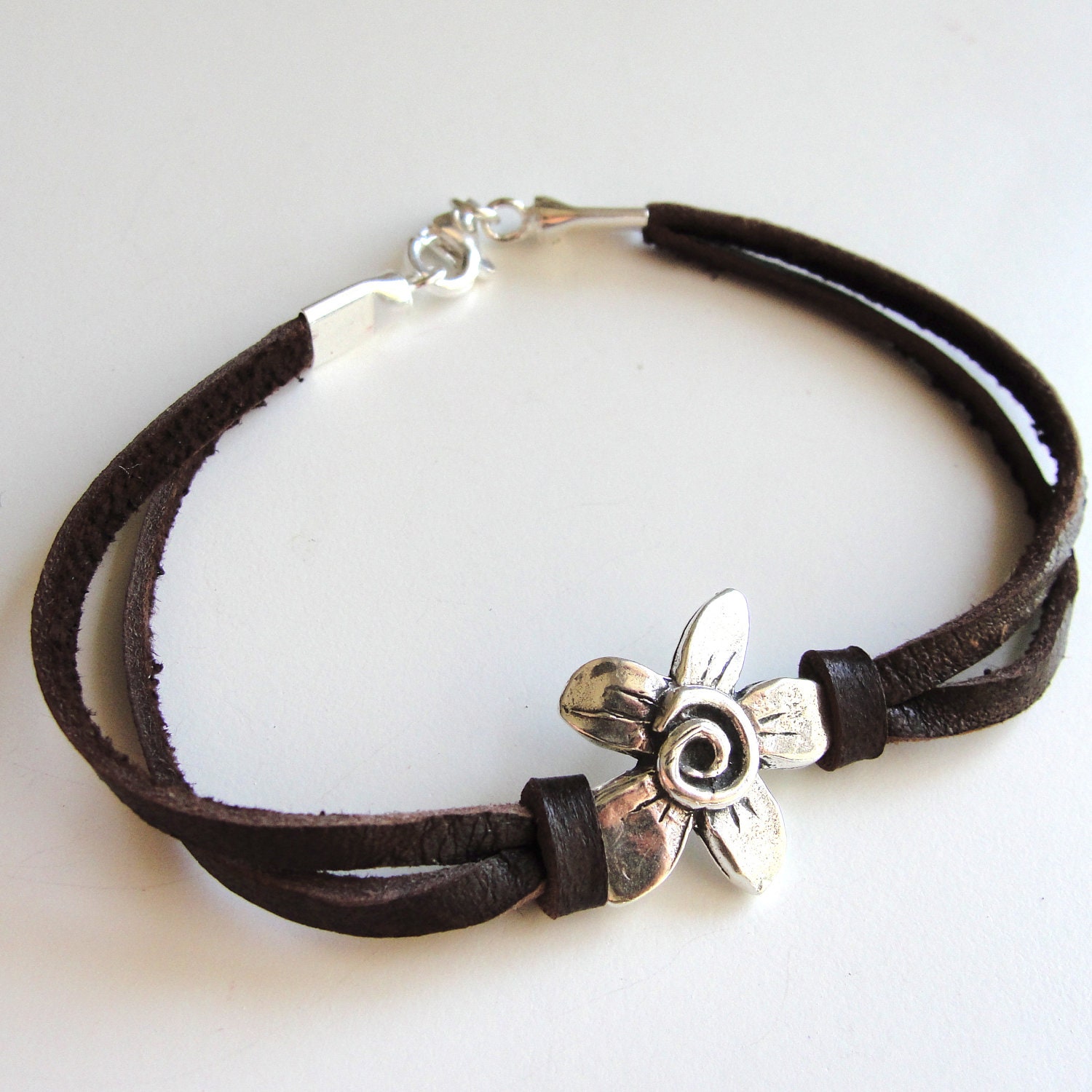 Sterling Spiral Fleur on Leather bracelet