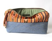on sale.  12-inch Zipper Pouch: striped denim and hand woven ikat fabric